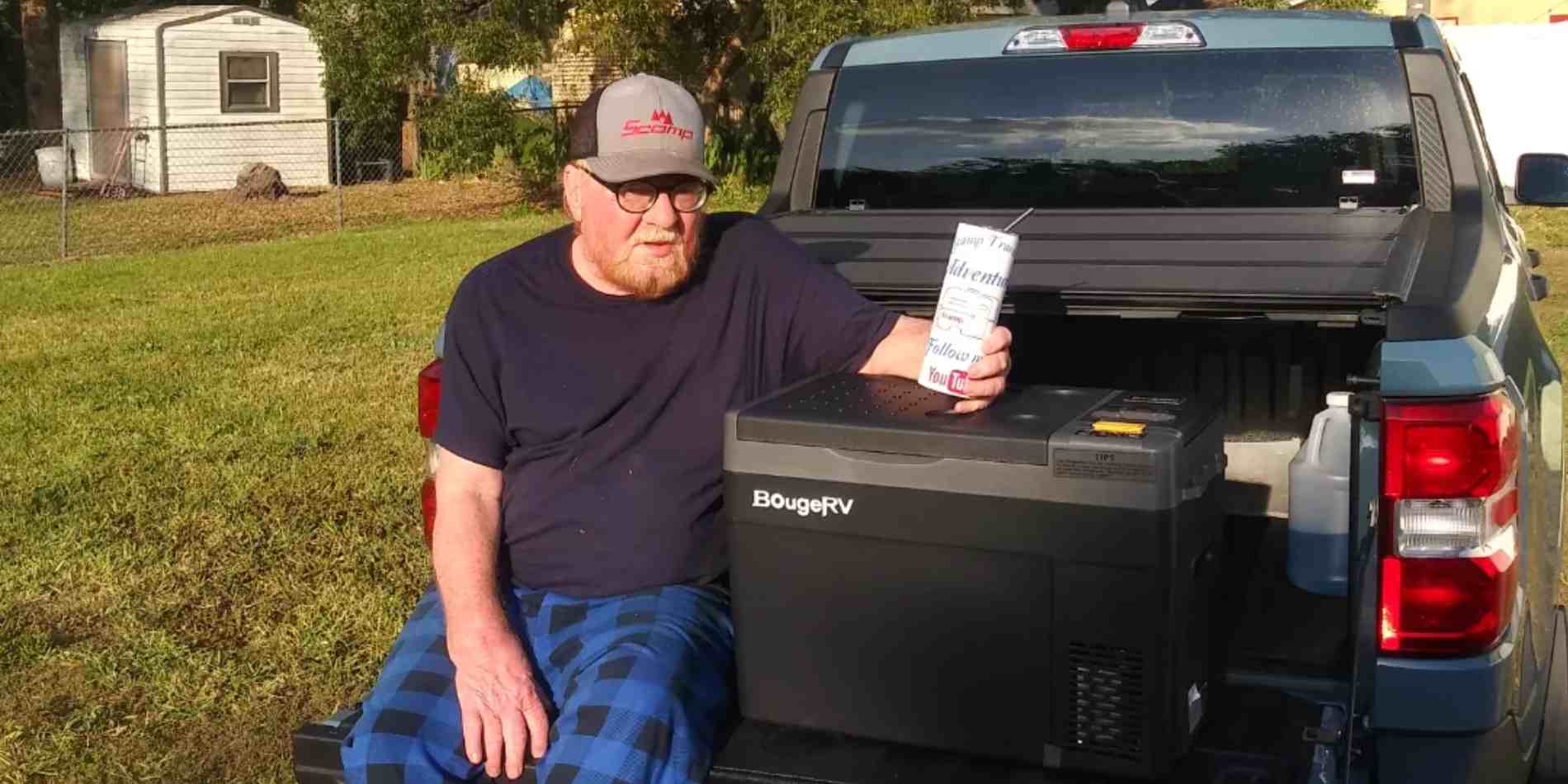 A man and BougeRV 12V portable fridge