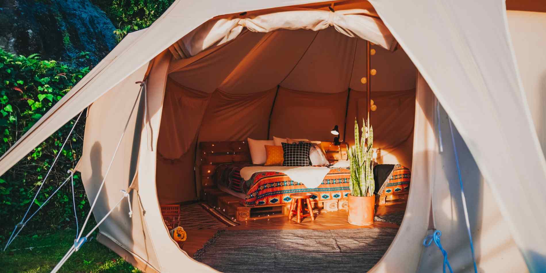 Glamping tent, bed, and glamping accessories